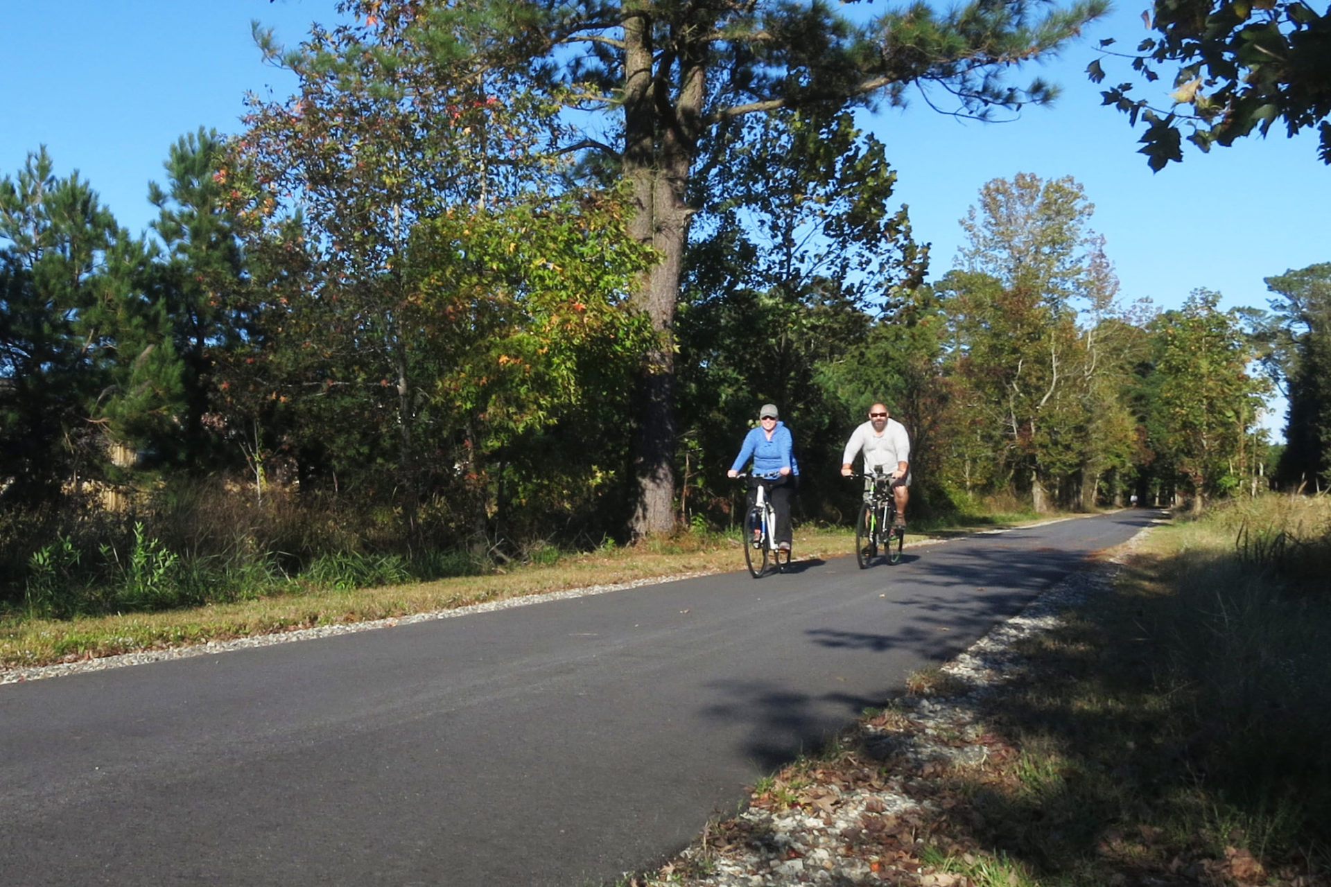 Couple riding bikes on the City of Suffolk Seaboard Coastline Trail