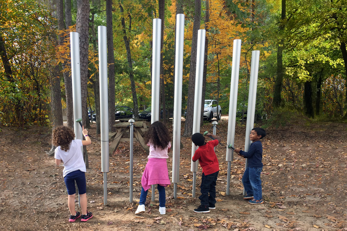Kids playing with sound outdoors at Douglas Elementary School in Raleigh, North Carolina.