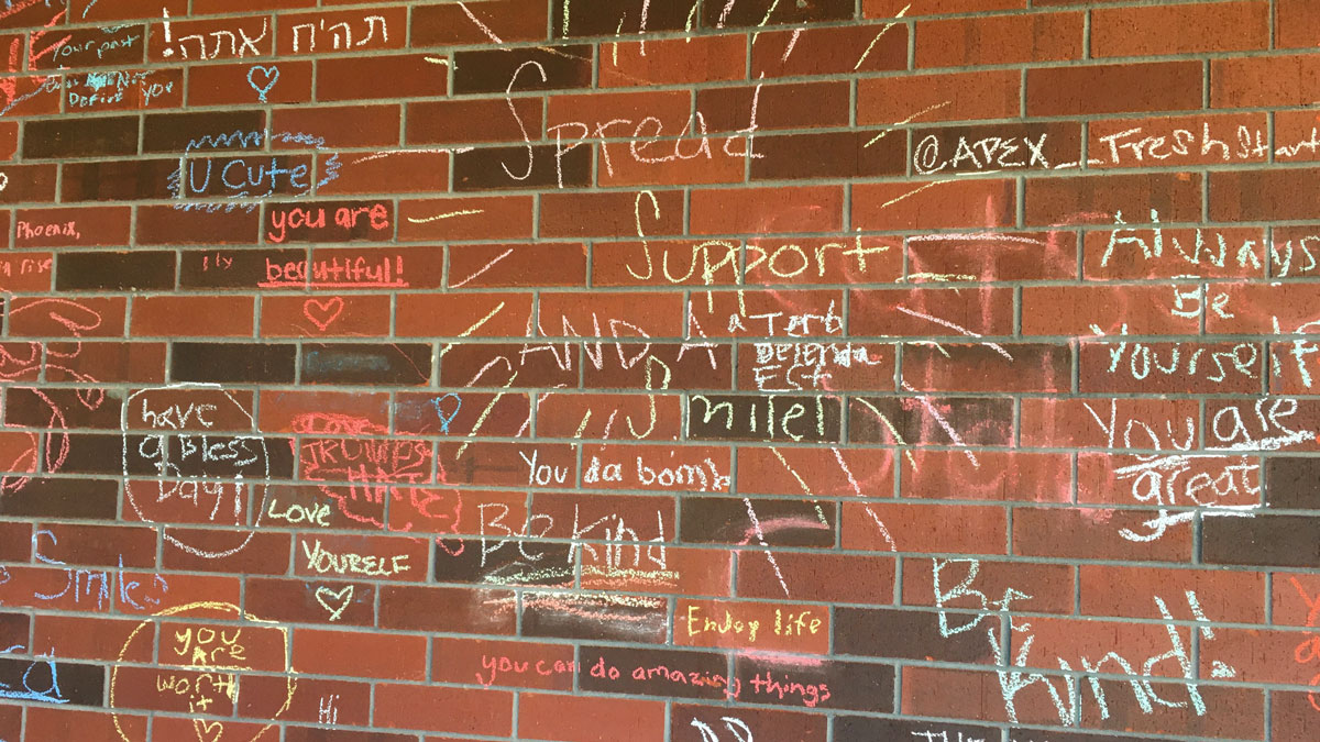 Courtyard wall at Apex High School promoting kindness and positivity