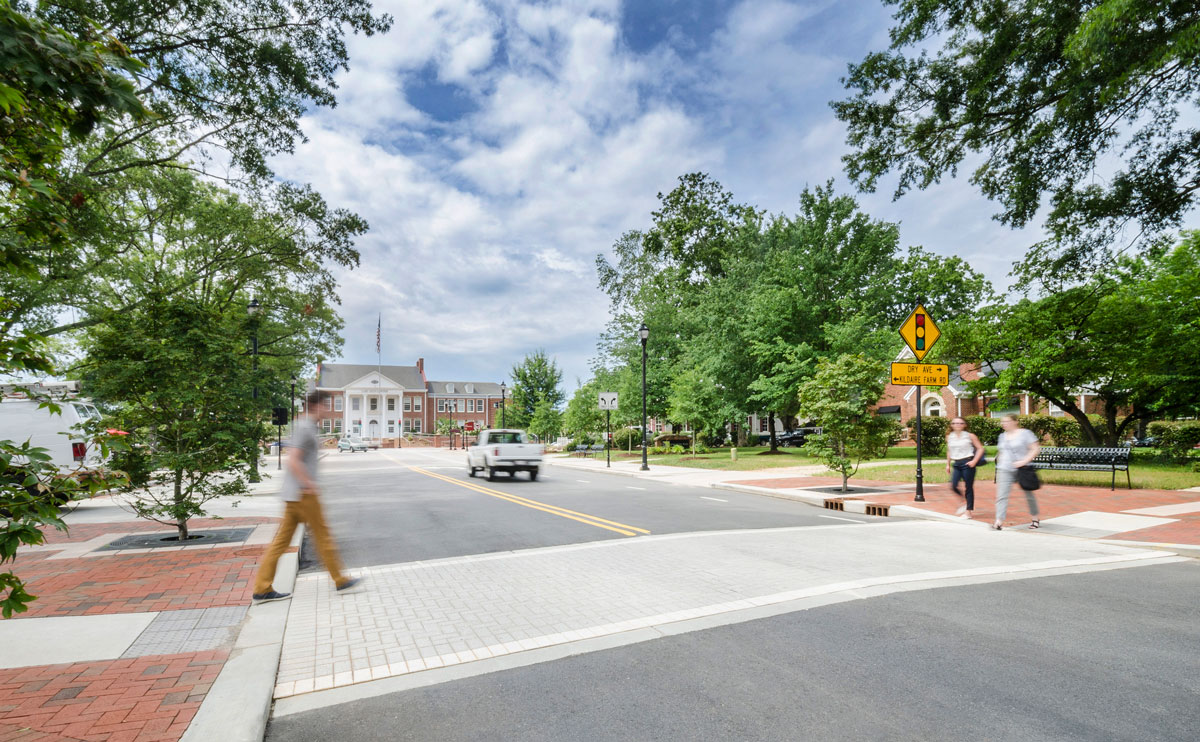 Academy Street’s wide sidewalks and clearly marked crosswalks support pedestrian safety and accessibility.